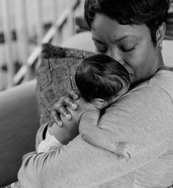Brian Musso wife Heather Headley with their baby girl